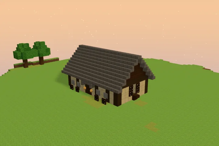 The armory alone: a long single-storey storehouse in a dark timber frame under a low grey roof