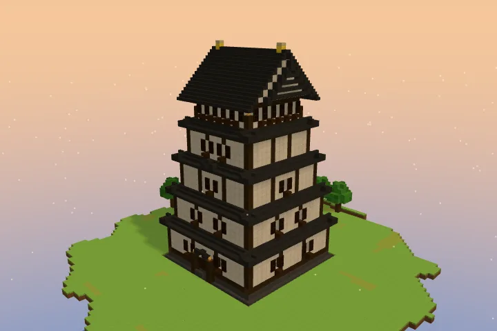 The keep of the Minecraft Japanese castle alone: five storeys of white walls in a dark frame, each under a dark roof, narrowing to a gabled top